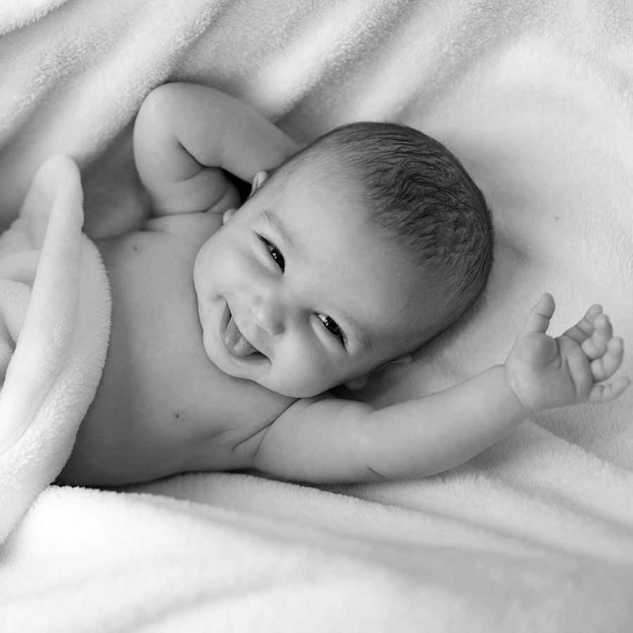 baby Family Portraits - Black and white photo with baby smiling