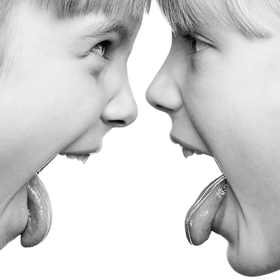 two young girls looking at each other