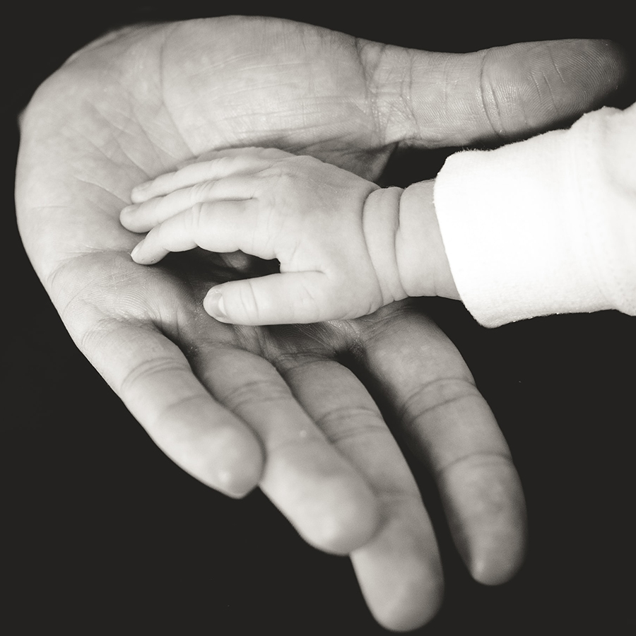 Father with babies hand